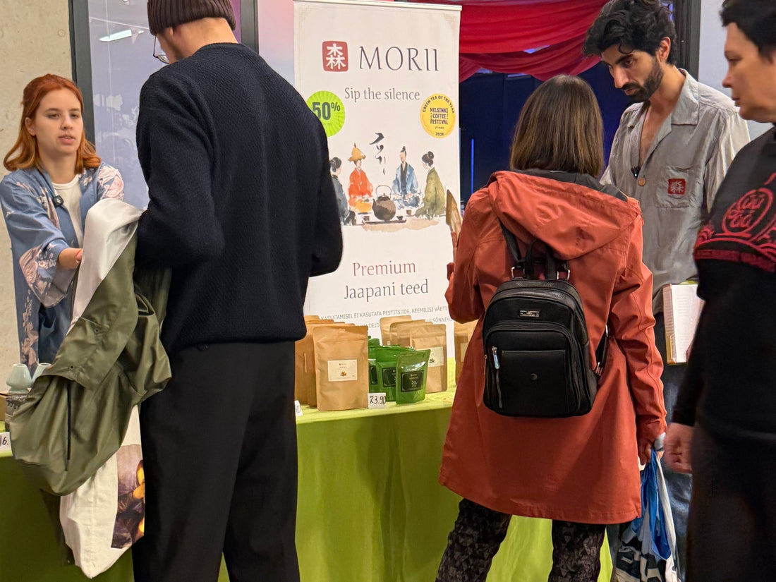 The Morii stand at Vegan Mess 2026 in Kultuurikatel, Tallinn: the team serving visitors next to the Morii banner and packs of Japanese tea